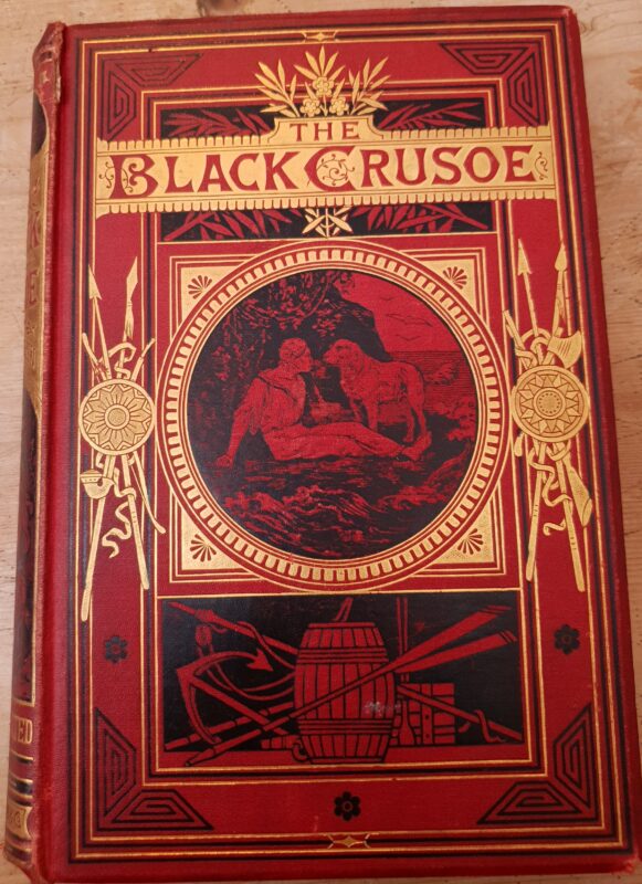 Einband von Le Crusoe Noir (1877), vorwiegend rot mit goldenen und schwarzen Elementen.